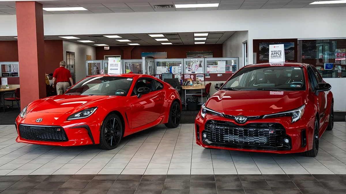 Red Toyota GR86 and GR Corolla in the Sloane Toyota of Philadelphia showroom