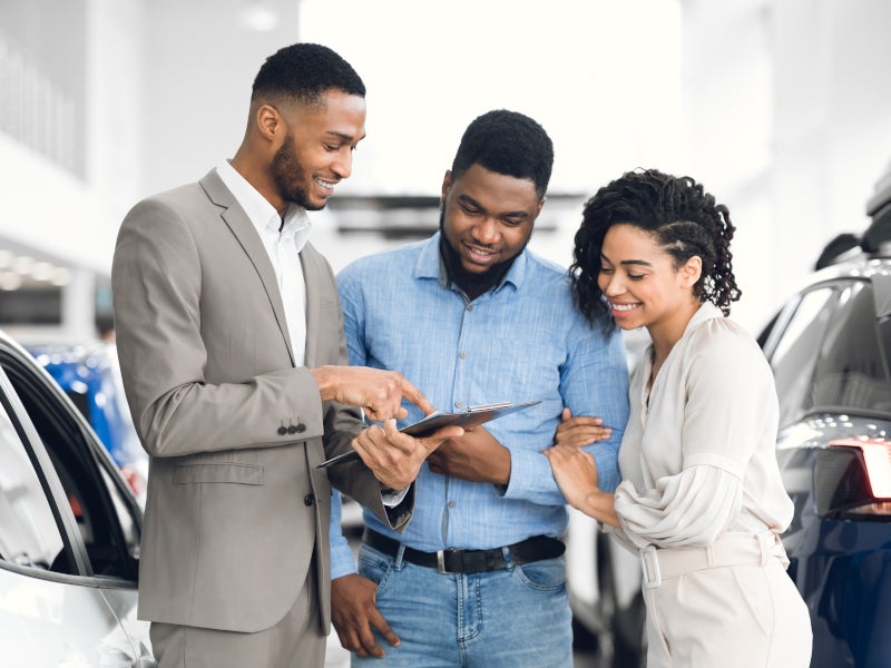 couple with salesman Sloane Toyota of Philadelphia in Philadelphia PA